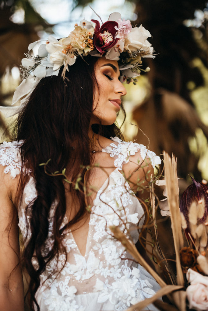 Elopement Photographer, A bride is in a wedding dress with a floral crown, she is happy