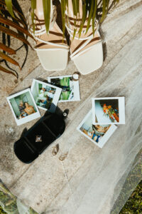 Wedding details rings shoes earrings and polaroids