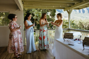 sisters giving a toast before wedding